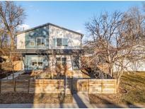 Beautiful two-story home with a combination of modern design elements and natural wood accents at 2952 S Delaware St, Englewood, CO 80110