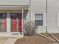 Inviting entrance featuring a red double door, natural light, and a classic exterior design at 1922 S Oswego Way, Aurora, CO 80014