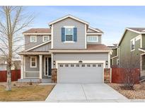Charming two-story home featuring a two-car garage and craftsman details at 10465 Evansville Cir, Parker, CO 80134