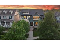 Charming two-story home with landscaped yard and inviting front porch at 2773 Havana St, Denver, CO 80238