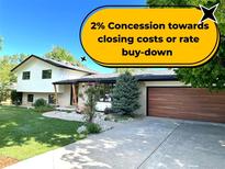Charming two-story home with modern accents, manicured lawn, and well-maintained landscaping at 11569 W 27Th Ave, Lakewood, CO 80215