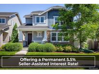 Charming two-story home featuring stone accents, a covered porch, and professionally landscaped front yard at 5451 W 73Rd Ave, Westminster, CO 80003