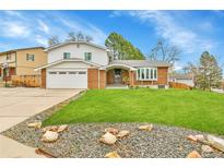 Charming two-story home with brick accents, well-manicured lawn, and attached two-car garage at 7796 S Marshall Ct, Littleton, CO 80128