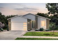 Charming single-Gathering home showcasing a manicured lawn, attached garage, and a welcoming front entrance at 4145 N Duquesne Ct, Aurora, CO 80019