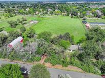 Expansive aerial view showcases property's large lot, outbuildings, and picturesque surroundings; close to city at 14650 Tejon St, Broomfield, CO 80023