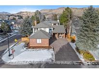 Two-story home with attached garage and landscaping, aerial view at 7 Red Maple, Littleton, CO 80127