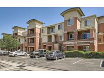 Exterior of a multi-story apartment building featuring brick accents and well-maintained landscaping at 4100 Albion St # 611, Denver, CO 80216