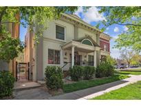 Charming home with classic architectural details, inviting porch, and well-maintained landscaping at 1580 N Franklin St, Denver, CO 80218