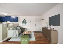 Bright living room features modern furniture, decor, and sleek wood-look flooring at 70 N Grant St # 10, Denver, CO 80203