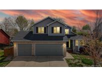 Charming two-story home with a two-car garage and brick accents beneath a dark roof at 2314 Flagstaff Dr, Longmont, CO 80504