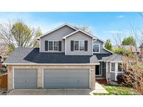Charming two-story home featuring a three-car garage, neutral siding, and a well-maintained front yard at 2314 Flagstaff Dr, Longmont, CO 80504