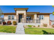 Beautiful ranch home with stone accents and a covered porch at 10761 N Montane Dr, Broomfield, CO 80021