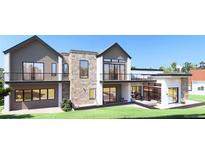 Stunning modern home featuring a stone facade, multiple balconies, and expansive windows providing ample natural light at 1055 Greens Pl, Erie, CO 80516