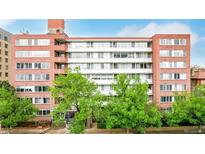 This attractive brick apartment building features large windows and mature trees in a desirable urban location at 1196 N Grant St # 705, Denver, CO 80203