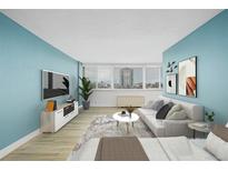 Inviting living room featuring modern decor, light wood floors, and scenic city views at 1196 N Grant St # 705, Denver, CO 80203
