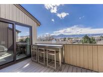 Relax on this balcony featuring a bar table with seating and enjoy the mountain views at 2938 Kalmia Ave # 27, Boulder, CO 80301