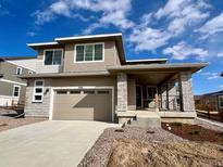 Beautiful two-story home featuring stone accents, neutral siding, a covered front porch, and an attached two-car garage at 3996 N Irvington St, Aurora, CO 80019