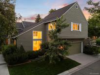 Charming home features a two-car garage and a lush green lawn at 4505 S Yosemite St # 362, Denver, CO 80237