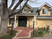 Stunning two-story home with manicured lawn, brick pathway, lush landscaping, and covered front entryway at 4800 S Franklin St, Cherry Hills Village, CO 80113