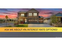 Charming two-story home with a well-manicured lawn and two-car garage showcasing suburban living at its finest at 2177 Shadow Creek Dr, Castle Rock, CO 80104