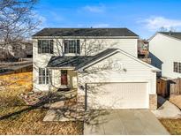 Charming two-story home with attached garage and inviting front entrance in quiet neighborhood at 2715 E 131St Ave, Thornton, CO 80241