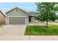 Charming single-Gathering house featuring a well-kept lawn and a two-car garage at 268 Naples St, Firestone, CO 80520