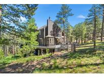 Stunning two-story home with a large deck, lush landscaping, and beautiful mountain views at 160 Bristlecone, Boulder, CO 80304