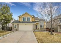 Two-story house with attached garage and landscaping at 2946 S Espana Ct, Aurora, CO 80013