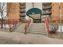 Inviting building entrance with grand steps and well-maintained landscaping, offering easy access to the property at 955 Eudora St # 1107, Denver, CO 80220