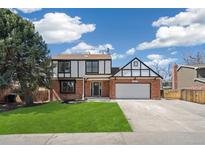 Charming two-story home with well-manicured lawn and classic brick exterior at 12807 Garfield Cir, Thornton, CO 80241