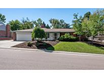 Ranch style home with landscaped yard and attached two-car garage at 3792 E Briarwood Ave, Centennial, CO 80122