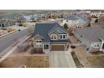 Charming two-story home in a Gathering-friendly community with a well-maintained lawn at 5404 Fawn Ridge Way, Castle Rock, CO 80104