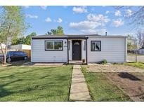 Charming home featuring a well-maintained front lawn and inviting entryway. Perfect for a cozy suburban lifestyle at 4401 W Mississippi Ave, Denver, CO 80219
