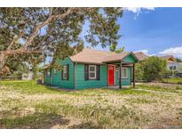 Charming home with a red front door and well-maintained green exterior at 4730 S Huron St, Englewood, CO 80110