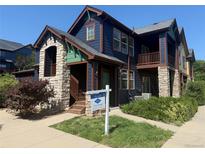 Charming two-story home showcasing stone accents and a welcoming front porch at 2552 W 82Nd Ln # C, Westminster, CO 80031