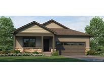 Charming single-story home featuring stone accents, a covered entry, and an attached two-car garage at 18785 E 99Th Ave, Commerce City, CO 80022