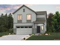 Charming two-story home with a two car garage, manicured lawn and beautifully landscaped yard at 19029 E 94Th Pl, Commerce City, CO 80022