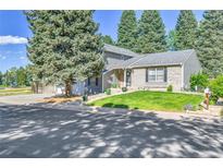 Charming gray two-story home with well-maintained lawn and mature landscaping at 4782 E Costilla Ave, Centennial, CO 80122