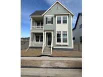 Charming two-story home featuring a double porch and stylish exterior accents at 191 Washington St, Erie, CO 80516