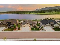 Stunning single-Gathering home with a three-car garage, landscaping, and scenic mountain and lake views at 2891 Waterfront Dr, Monument, CO 80132