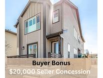 Stunning exterior elevation featuring a modern two-story home with a charming front porch and neutral color scheme at 10524 Eby Cir, Lone Tree, CO 80124