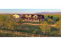 A charming two-story home has a great lawn and a mountain view at 4075 Merada Ct, Franktown, CO 80116