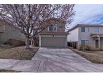 Exterior of a well-maintained two story home with a two car garage and a driveway on a sunny day at 4081 Odessa St, Denver, CO 80249