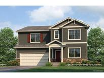Charming two-story home featuring neutral siding, a two-car garage, and a well-manicured lawn at 840 Leeward St, Lochbuie, CO 80603