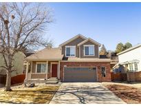 Charming two-story home with a well-maintained front yard and inviting curb appeal at 9703 Ogden Ct, Thornton, CO 80229
