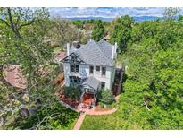Stunning aerial view of a stately home with mature trees and meticulously landscaped grounds at 5127 Lowell Blvd, Denver, CO 80221