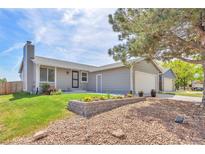 Charming single Gathering home with manicured lawn, beautiful flower beds, and a two car garage at 4182 S Joplin St, Aurora, CO 80013