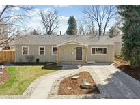 Charming single-story home with a well-maintained front yard and inviting walkway to the front door at 1430 S Glencoe St, Denver, CO 80222