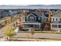 Charming two-story home featuring a welcoming front porch, modern architecture, and a beautifully landscaped neighborhood at 5965 Hanover St, Denver, CO 80238