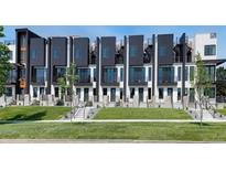 Modern townhomes with black and white exteriors, balconies, and spiral staircases at 3408 W 18Th Ave, Denver, CO 80204